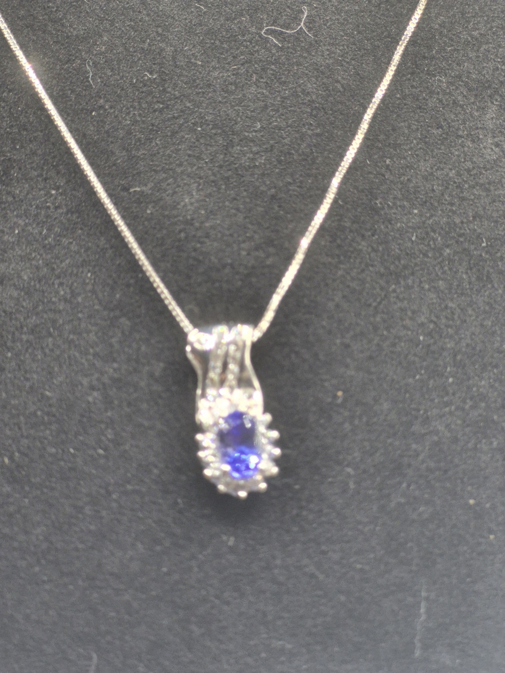 AAA Rated Oval Tanzanite With White Zircon Grace Halo Pendant